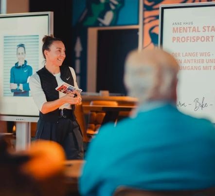 Anne Haug giving a talk to an audience
